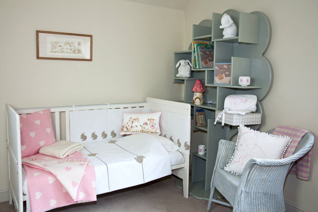 childrens nursery interior from white rabbit england with pink toadstool lamp and cot bed with rabbit bedding