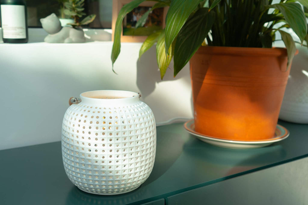 white ceramic lantern light with rope handle